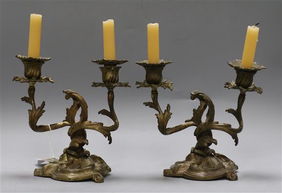 A pair of Louis XV design gilt metal two light candelabra, cast and chased with foliate, height 21cm